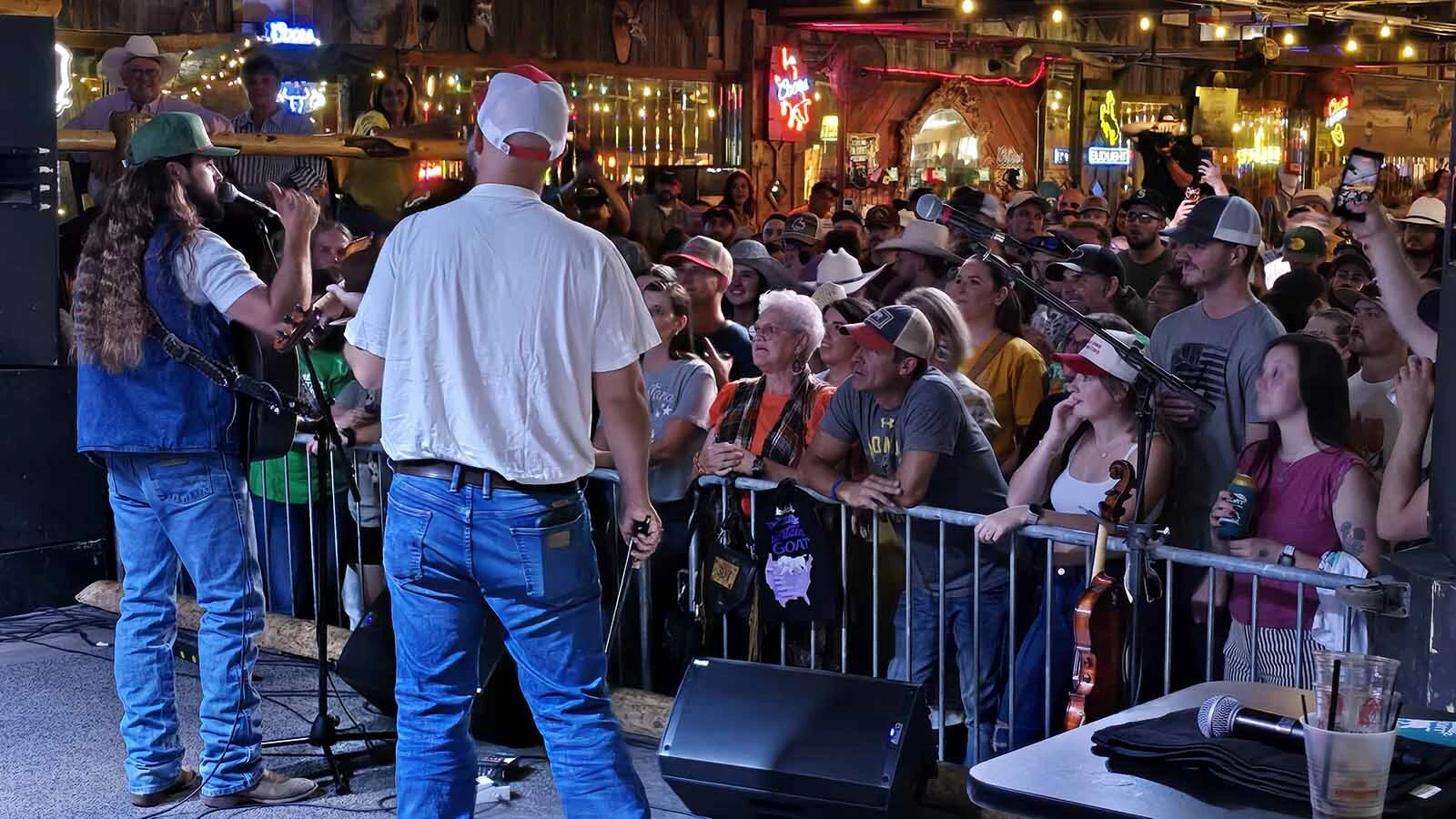 Ian Munsick talks to a jam-packed crowd at the Cowboy Saloon & Dance Hall in Laramie about his most recent album, The Mountain Goat, which is the first under his independent label, West to the Rest Records, in partnership with Triple Tigers Records.
