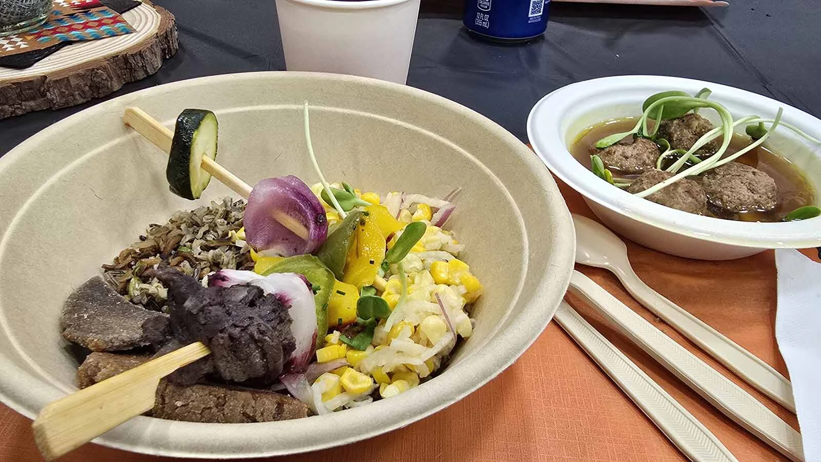 The all-Indigenous lunch plate included huckleberry-braised bison skewers with a wild rice and juniper pilaf, as well as bison meatball posole, roasted mushroom and bean medley, corn-wild rice cake, and jicama sweetcorn slaw.