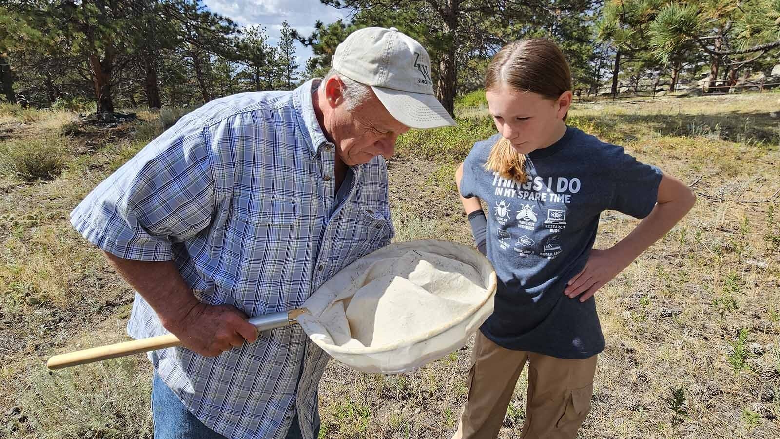 Nothing that time! Aaron Clark, left, and Allie Hazen, right, can't believe their sweep didn't even catch a single insect.