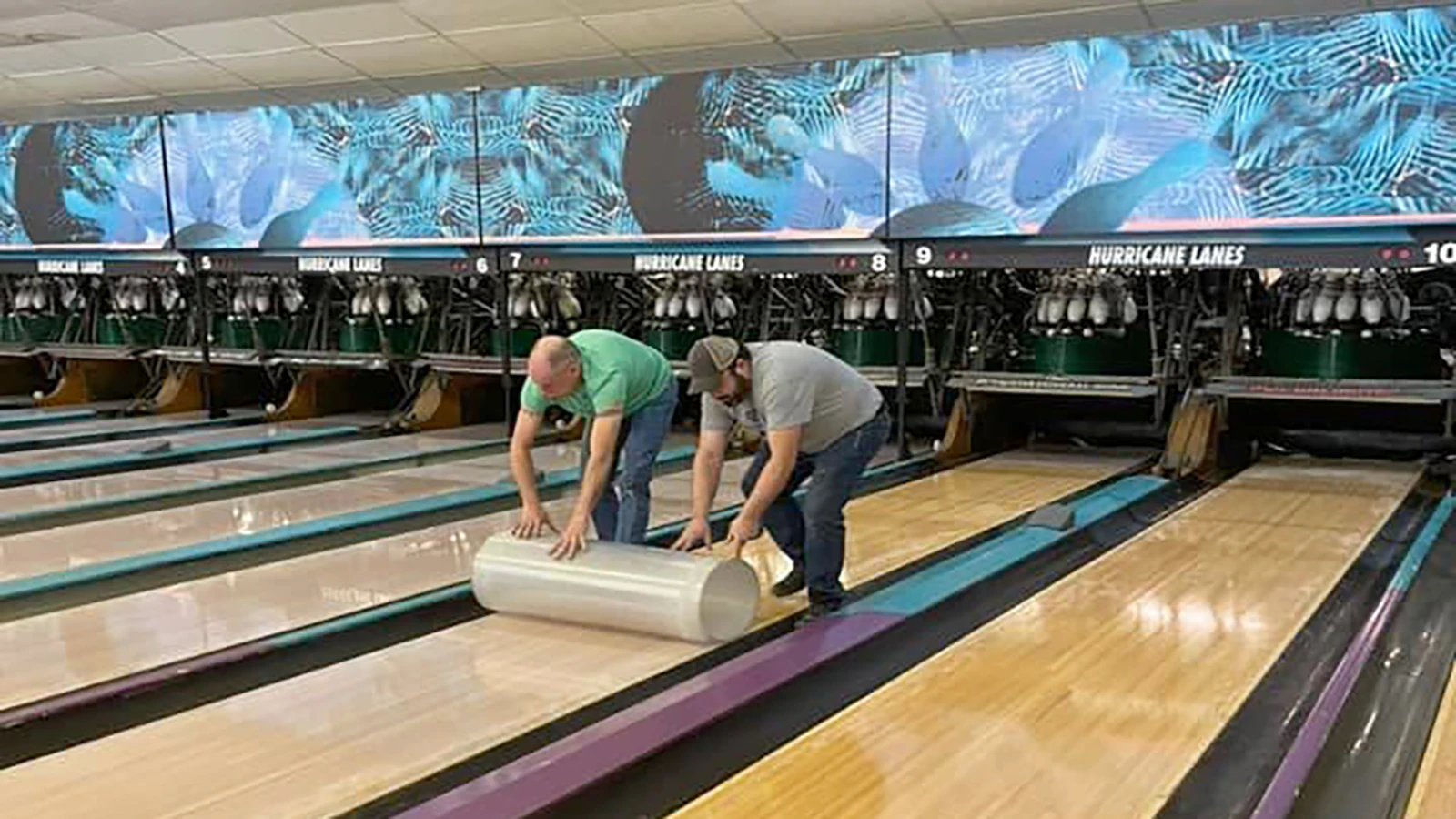 Workers install the synthetic lanes at Hurricane Lanes in 2021.