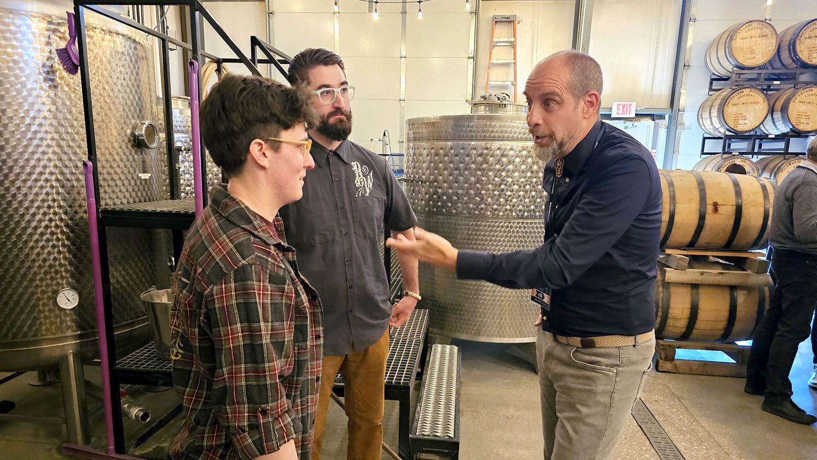 Christian Josso, right, from Italy talks to Amber and Chad Pollock about starting his whiskey tour at Backwards Distilling in Casper.