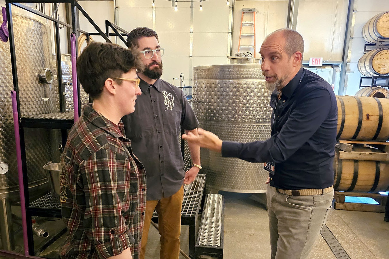 Christian Josso, right, from Italy talks to Amber and Chad Pollock about starting his whiskey tour at Backwards Distilling in Casper.