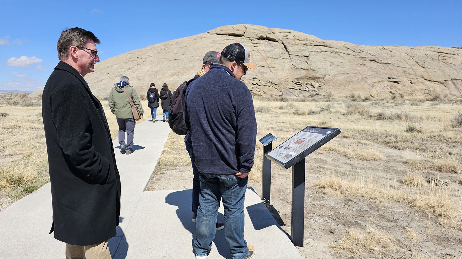 Tourism agents from Europe and Australia, and suppliers from Wyoming and beyond, visit Independence Rock on Saturday A few paused to read one of the history plaques along the way.