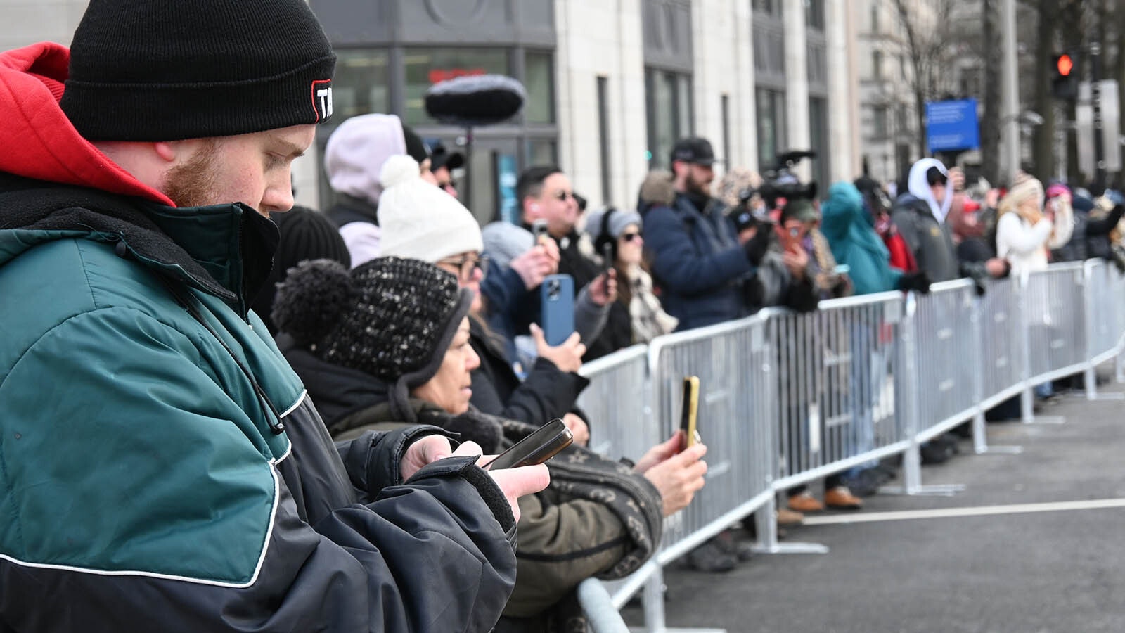 Onlookers line Pennsylvania Avenue in Washington for a glimpse of Donald Trump's motorcade before he was sworn in.