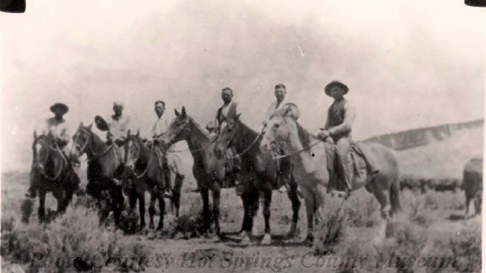 In 1935, these former Embar (M-Bar) cowboys posed on their horses 30 years after rounding up horses in the Big Horn Basin. L-R Jack Shafer, Irish Tom Walsh (holding his hat), Ed Majors, Frank James, E. A. Boots and Henry Johnson. All mounted and ready to ride.