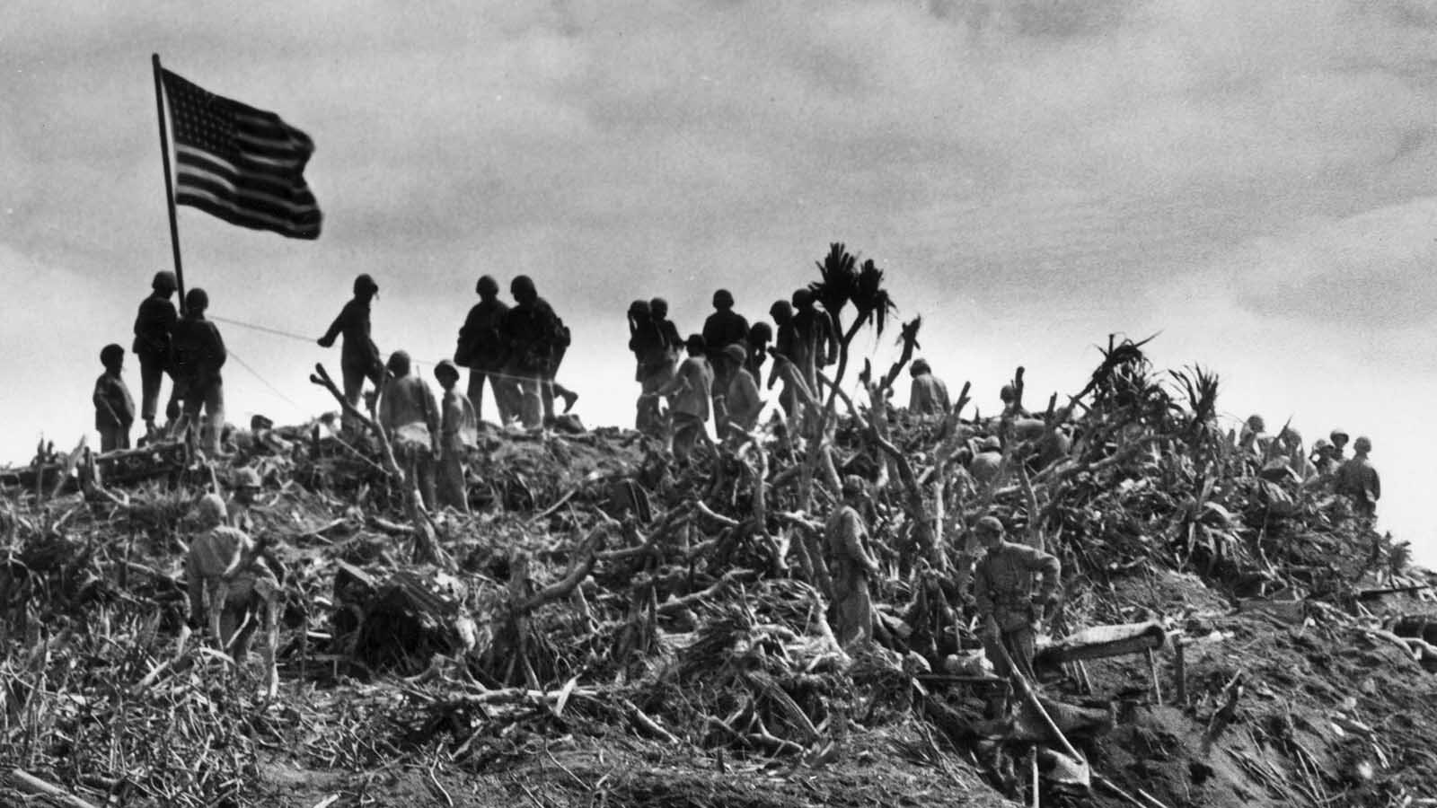 Feb. 23, 1945: View of marines planting a U.S. flag on Mount Suribachi, Iwo Jima during World War II. This was the second flag raised that day, being larger than the first.
