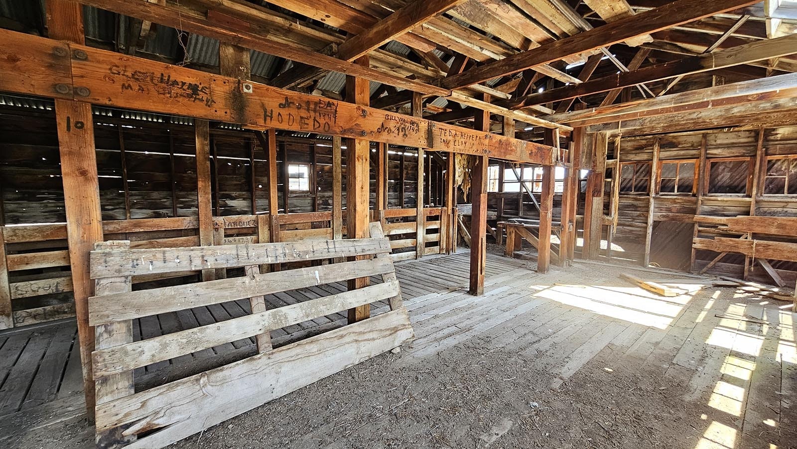 Names of sheep shearers are still carved into the wood at a sheep shearing barn at the JO Ranch in Carbon County.