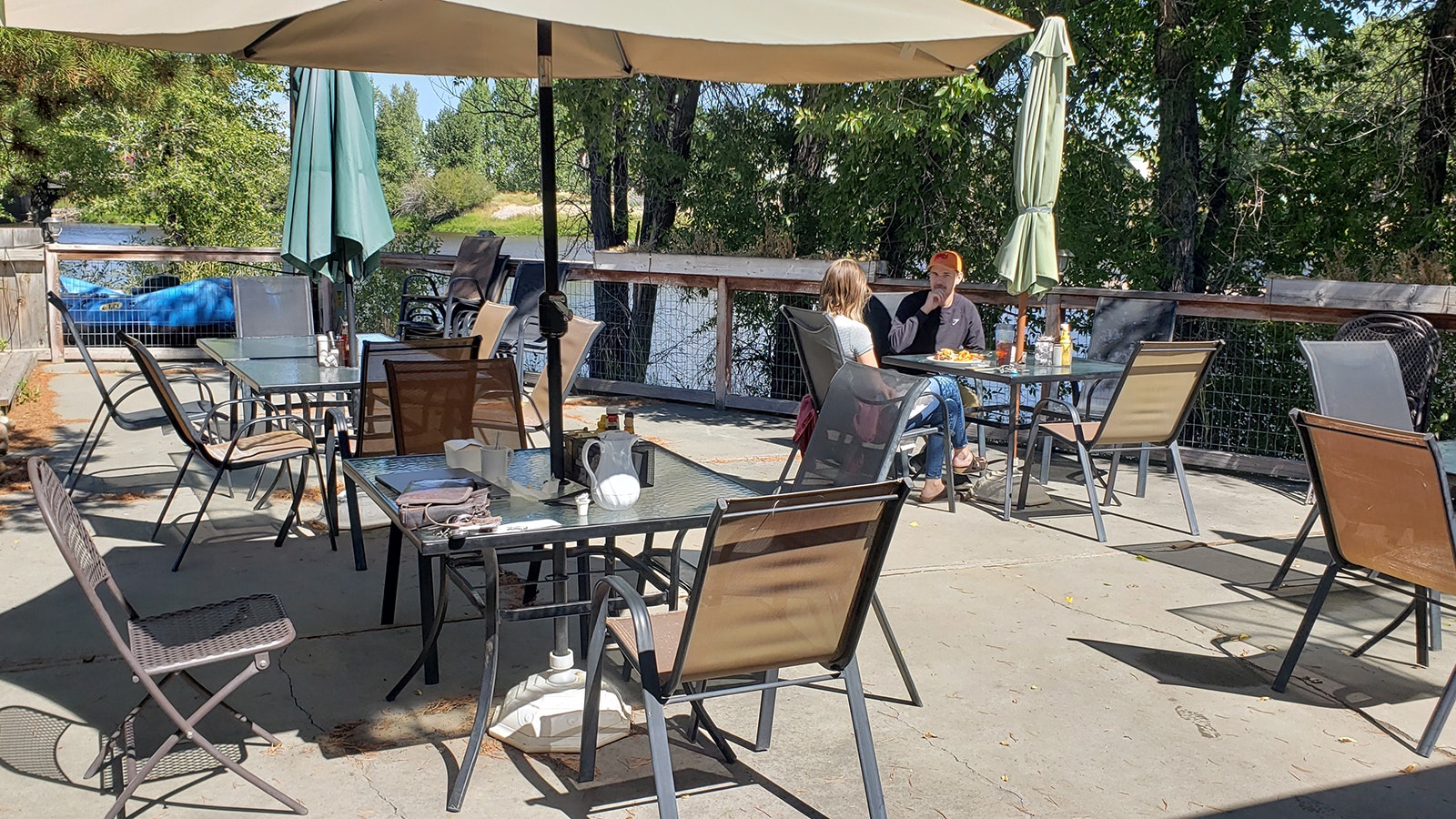 The riverside outdoor seating area at the J.W. Hugus Restaurant is popular during summertime.