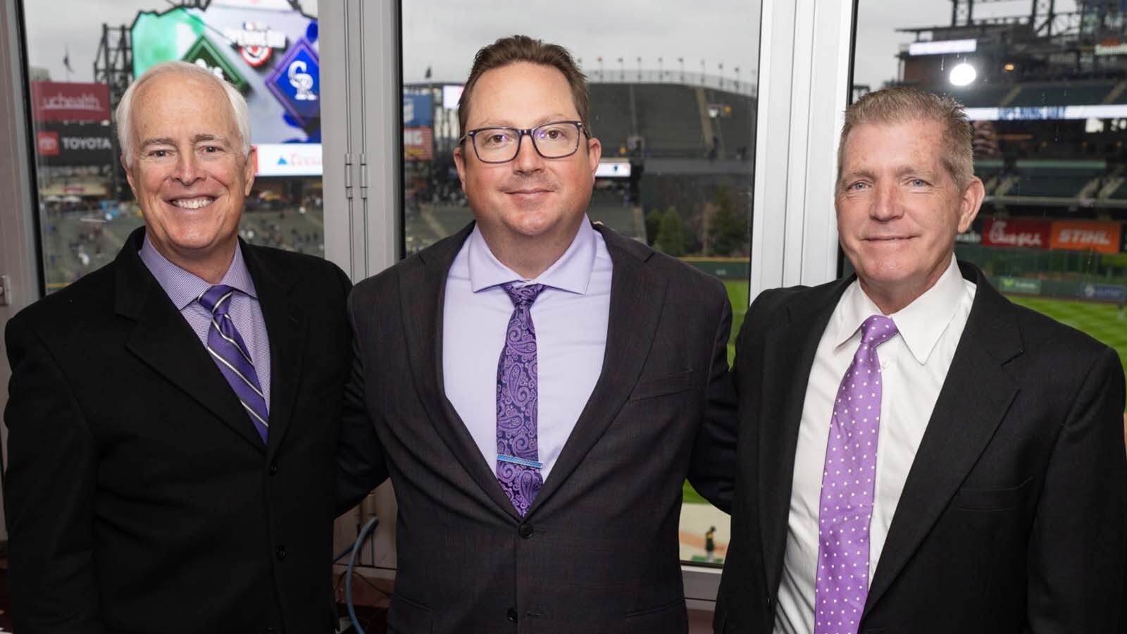 The Colorado Rockies radio broadcast team of Jack Corrigan, left, and partner Jerry Schemmel, right. They're pictured here with producer Jesse Thomas.