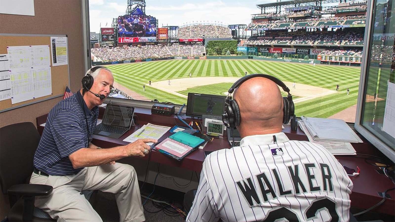 Longtime Colorado Rockies play-by-play radio announcer Jack Corrigan, left, interviews Rockies Hall of Fame right fielder Larry Walker.