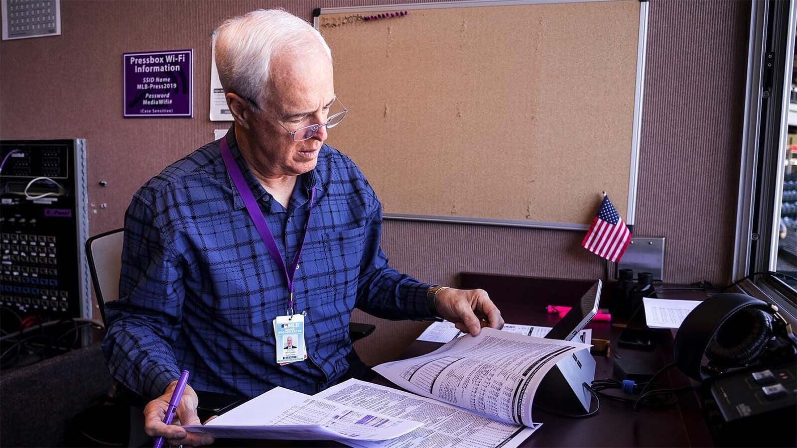 Jack Corrigan prepares to call a Colorado Rockies game.
