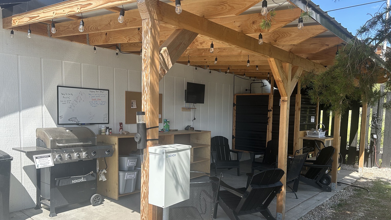 Outdoor space at the Jackalope Motor Inn in Pinedale provides a propane grill, television, Adirondack chairs, laundry and bins for hikers.
