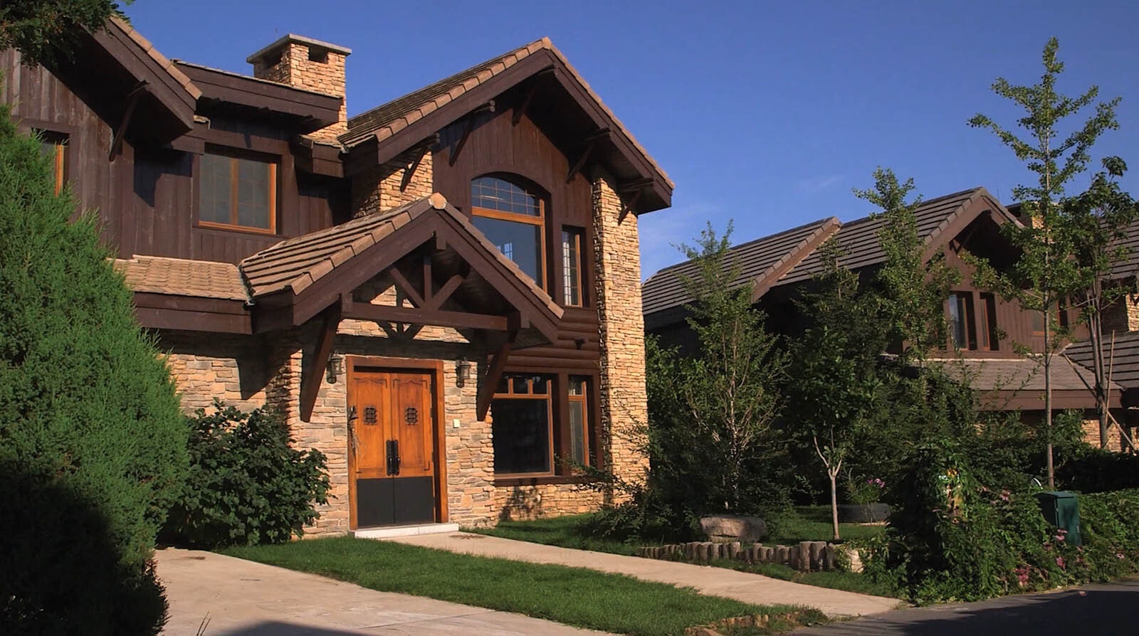 A scene from "Americanville" that shows a typical mansion in Hometown, USA that would fit right in in Jackson, Wyoming.