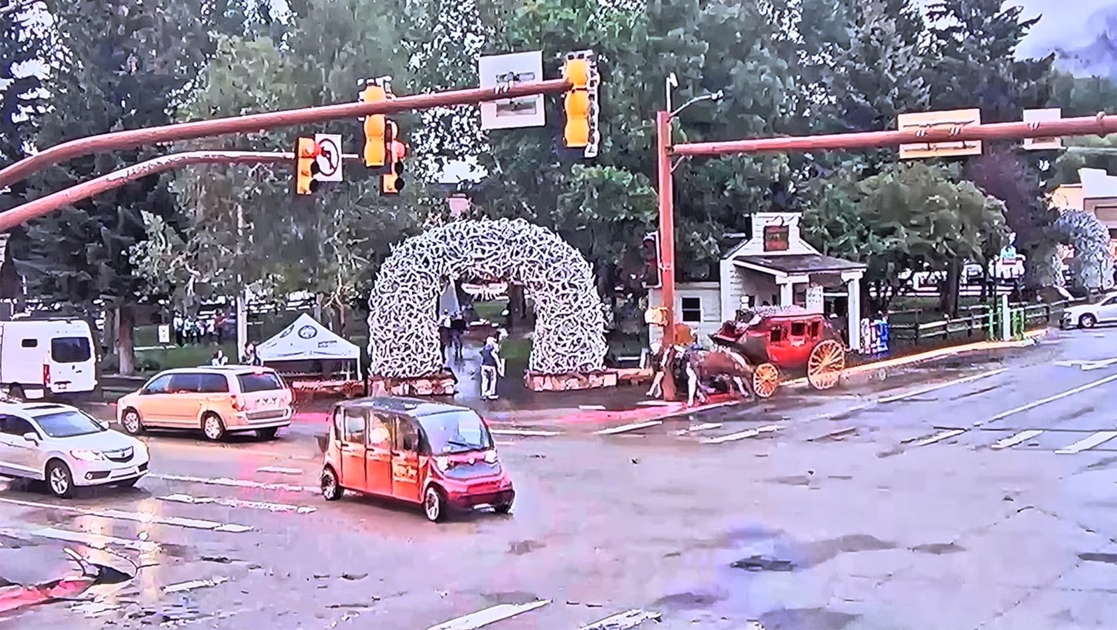This screen grab from a live video feed at SeeJH.com shows a team of horses pulling a stagecoach barreling into a light pole in downtown Jackson, Wyoming.