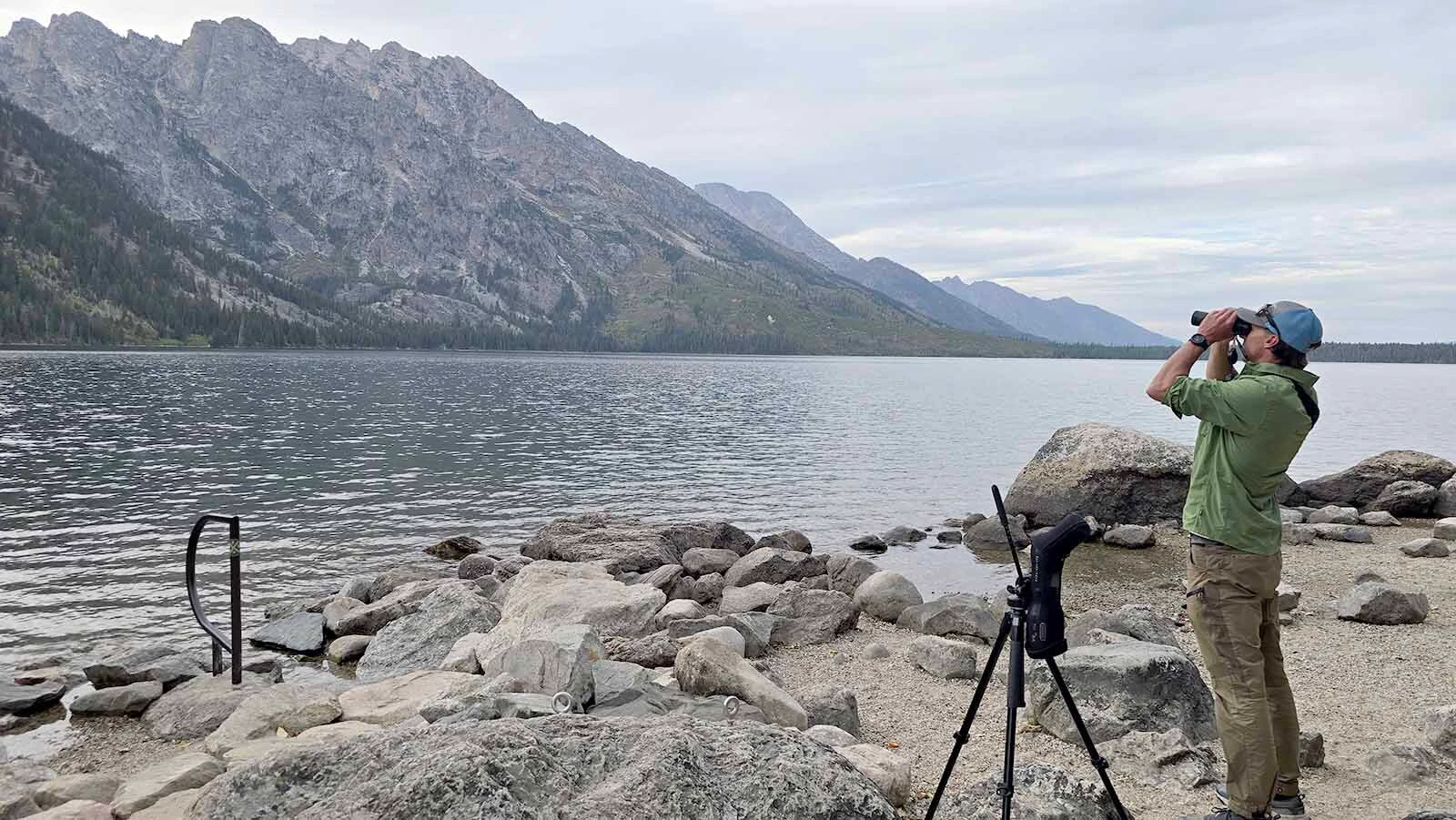 Tyler Griffin scans the far side of Jenny Lake for elk.