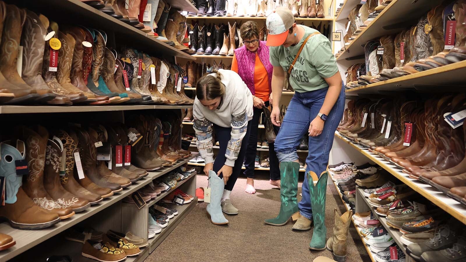 Kayden, Janet and Jansen Curry all look for their Jae Boots at the Casper Boot Barn. Kayden is the Kelly Walsh senior class secretary and Jansen Curry said all three are supporters of the McMurry Foundation and the Jae Foundation and came to hear the Jae Foundation presentation. “We didn’t know we were getting boots,” Janen Curry said. “It’s kind of cool.”