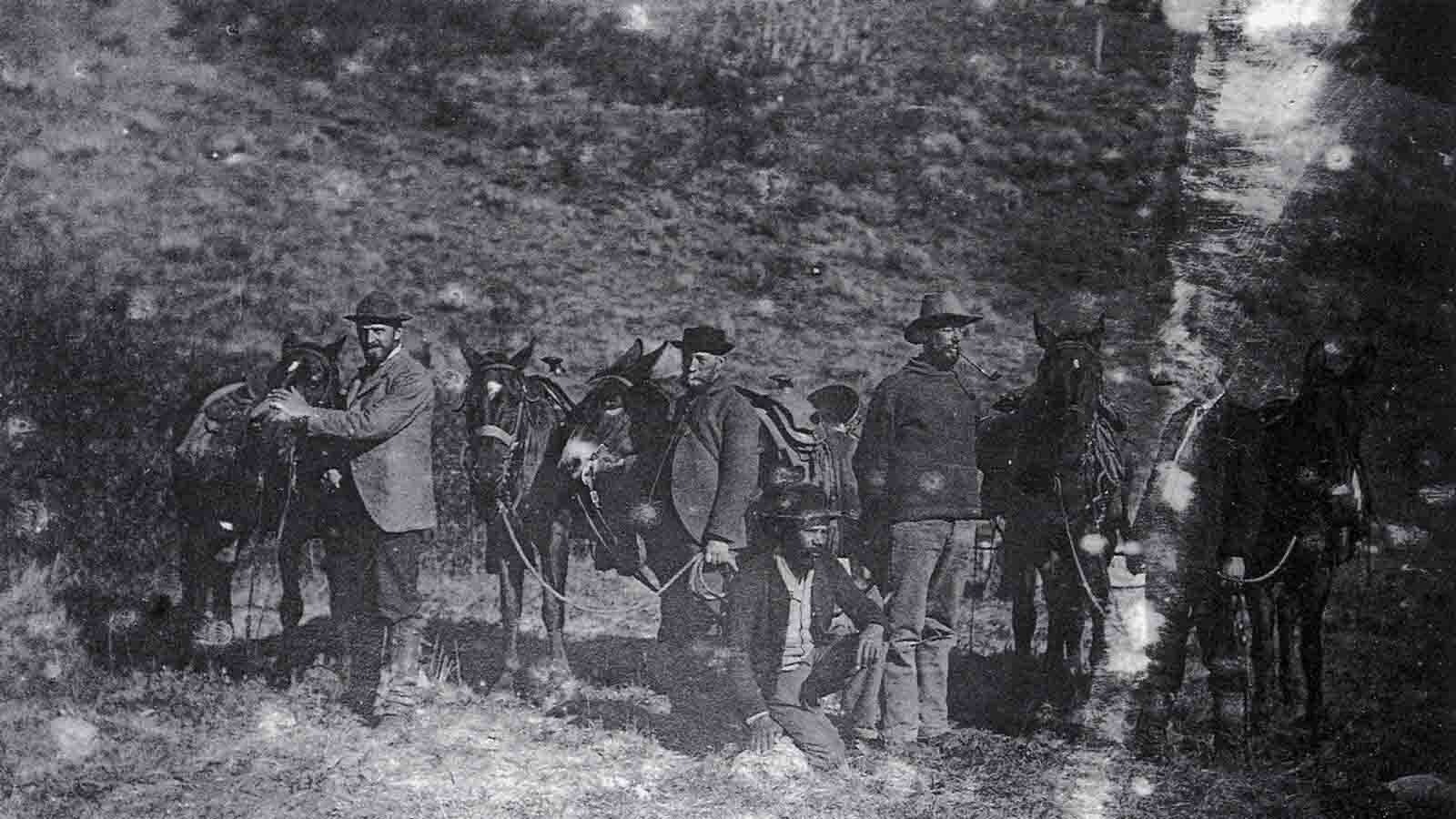 Arnold Hague’s Absaroka Geology Survey Party posing near Mammoth Hot Springs on Sept. 25, 1893. The men pictured are (left to right) Thomas Jaggar, Arnold Hague, John Anderson (camp cook), Frederick Koch (head packer) and John Condiff (packer).