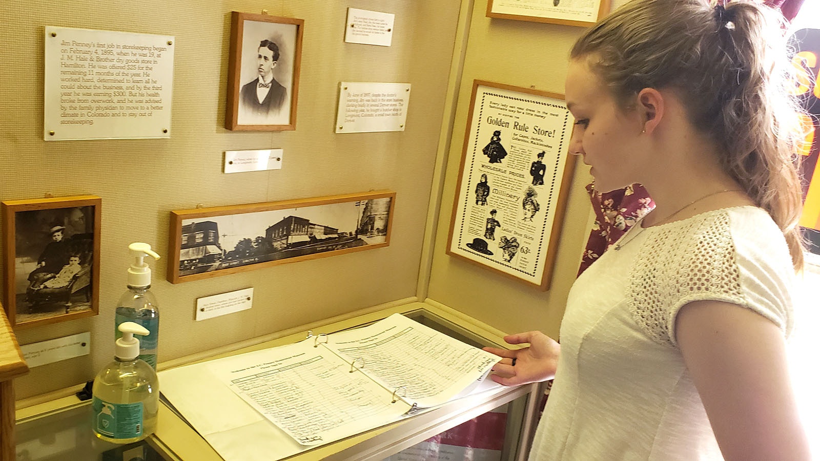 Janelle Sawaya looks at a visitor guest book that shows people coming from all over the world to learn more about James Cash Penney, even one from New Zealand.