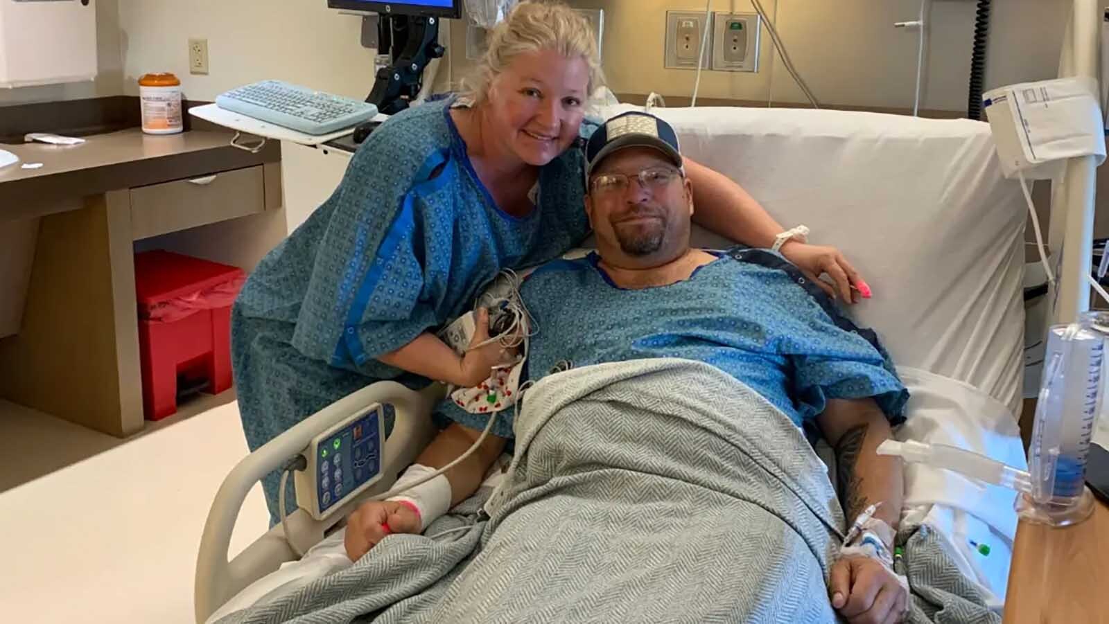 Tara and James Harris pose in the hospital together after Tara’s kidney donation.