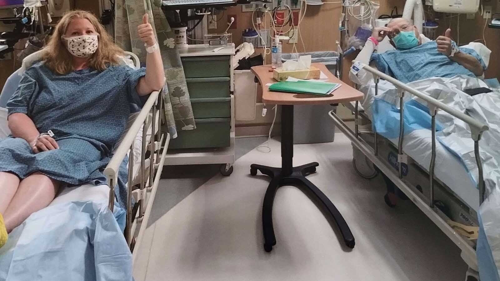 Tara and James Harris give the thumbs up at a Denver-area hospital as Tara prepares to donate her kidney for her husband in 2021.