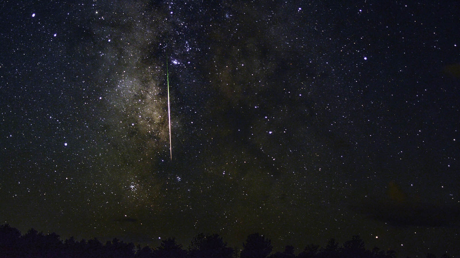 A bright Perseid meteor with the Milky Way in the background.
