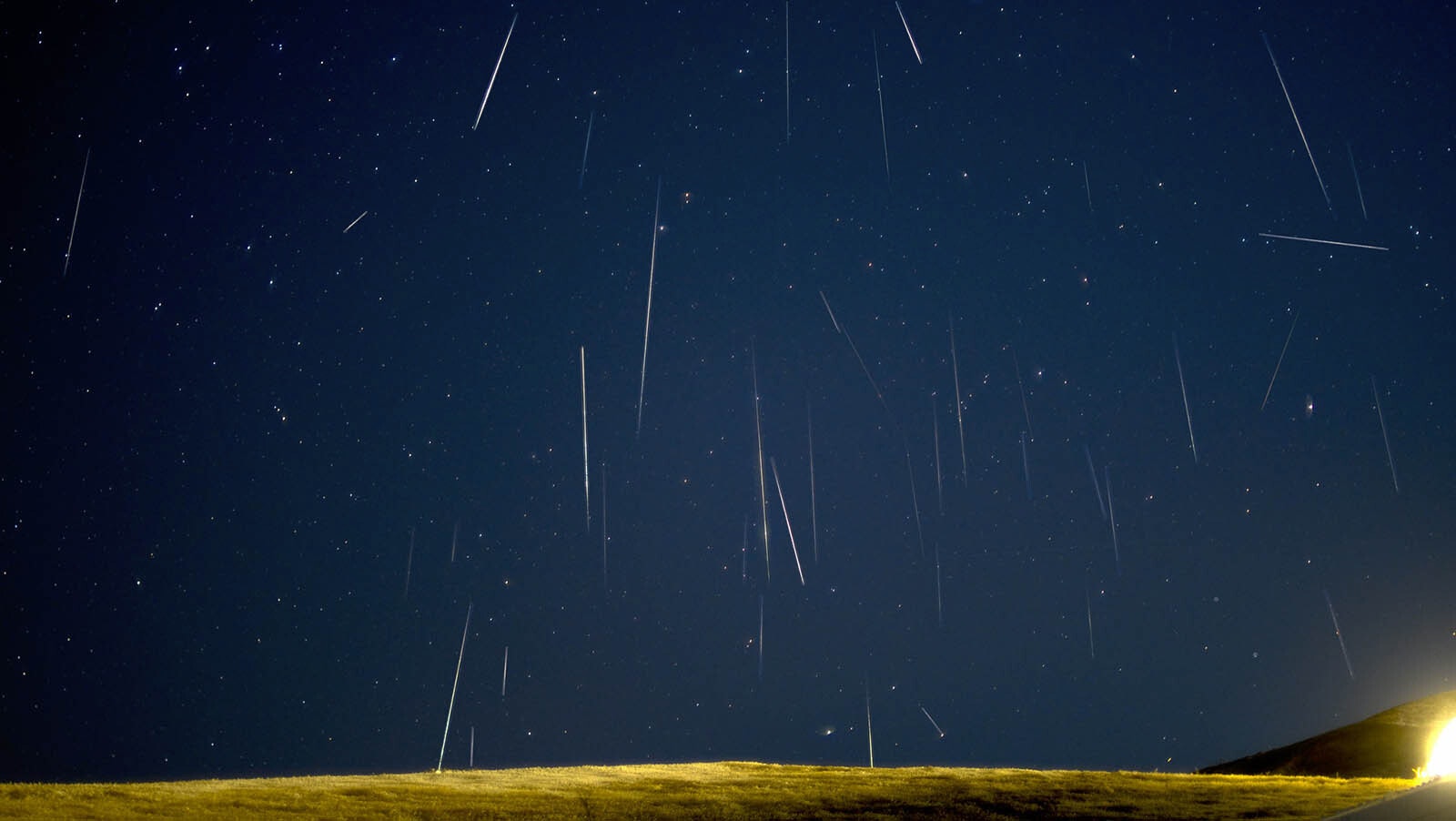A veritable shower of Gemini's raining down on the horizon. This image was created by taking exposures every 10 seconds for 10 hours, recording 69 meteors, 49 of which are in this image.