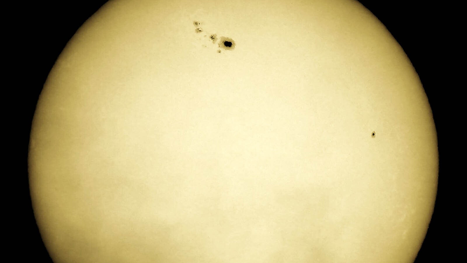 This naked eye sunspot — basically a spot on the sun so huge it can be easily seen — looks like the Hawaiian islands. It was captured with a Nikon Coolpix P950.