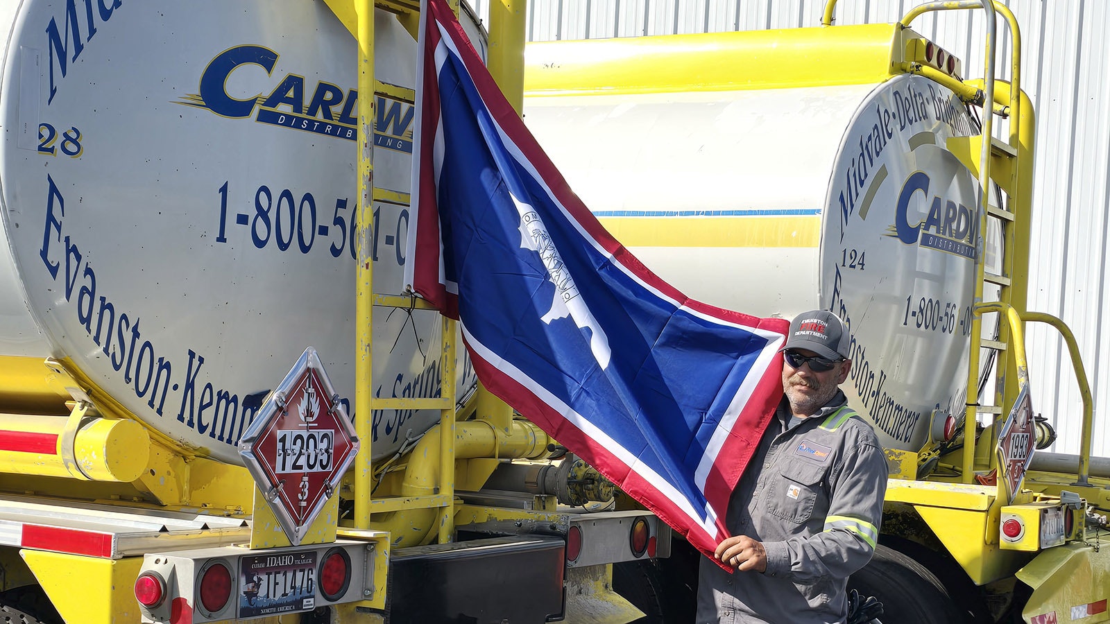 Jaron Fry pulls out the Wyoming flag he's displaying on his truck in North Carolina, where he's helping out by delivering fuel to the hurricane-devastated area.