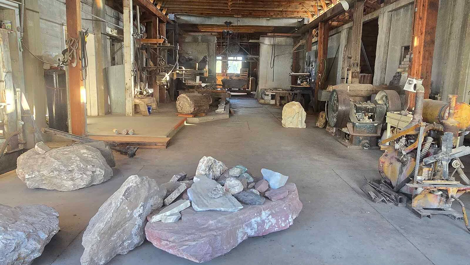 Inside look at the stonecutting garage in Jay Em. Stones lay on the floor perpetually waiting to be cut.