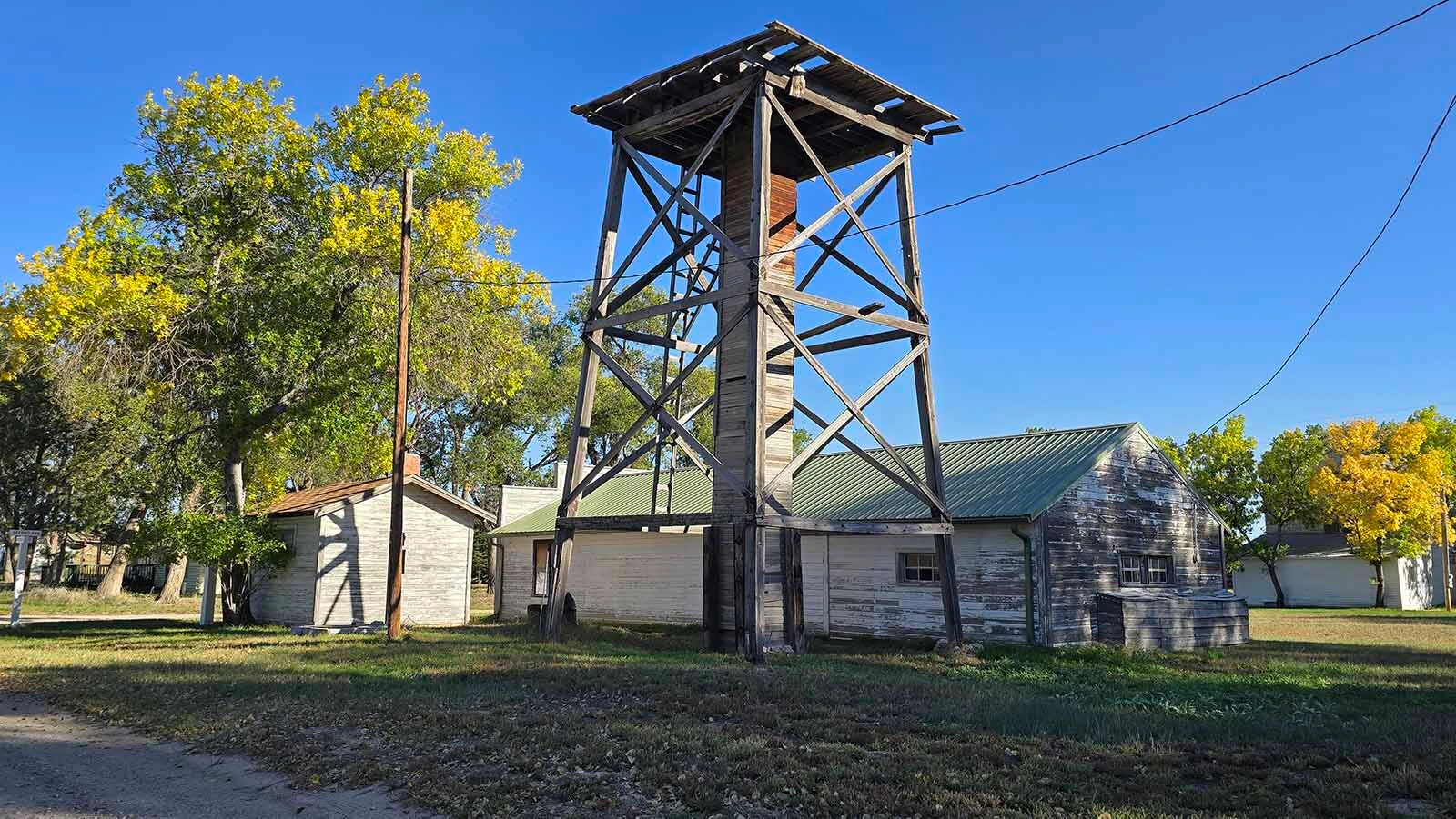 A cluster of buildings with a tower in Jay Em.