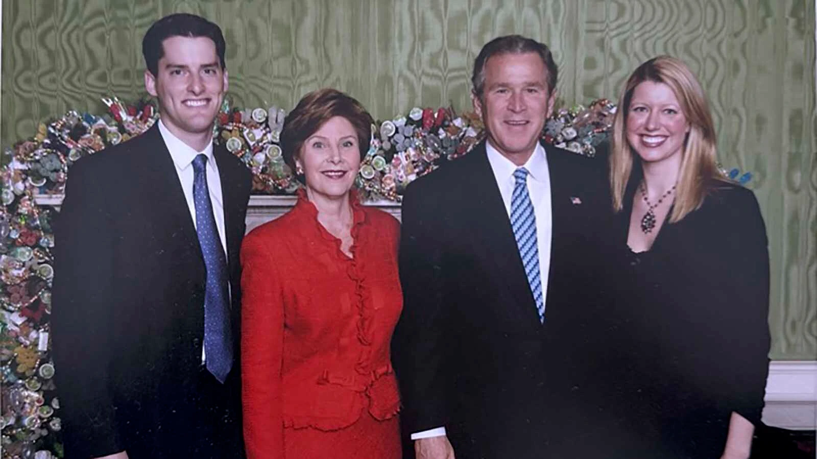Jenica and Dave McMaster pose for a photo with former President George W. Bush and first lady Laura Bush.