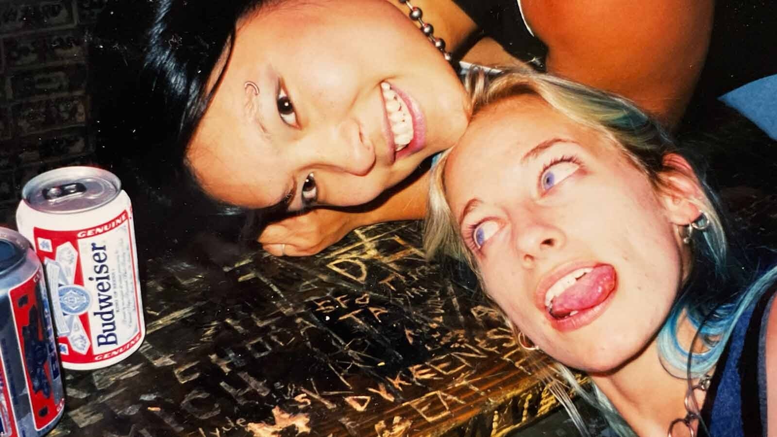 Jennifer Dyke by her name carved into the bar at the Dungeon Bar in Sturgis, South Dakota.