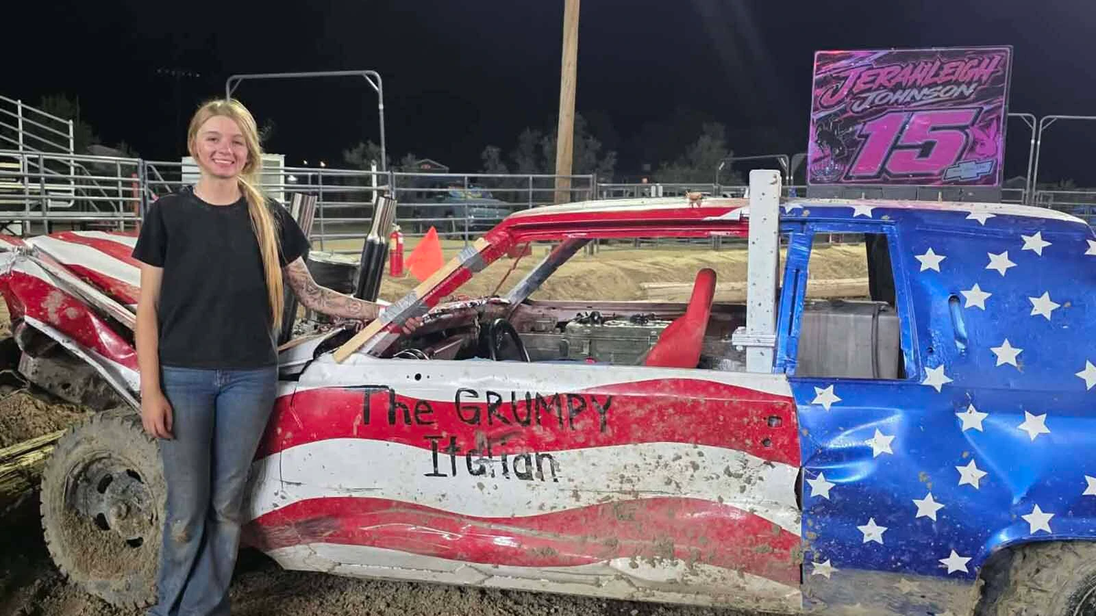 Jerahleigh Johnson stands beside her patriotic No. 15 Cadillac.
