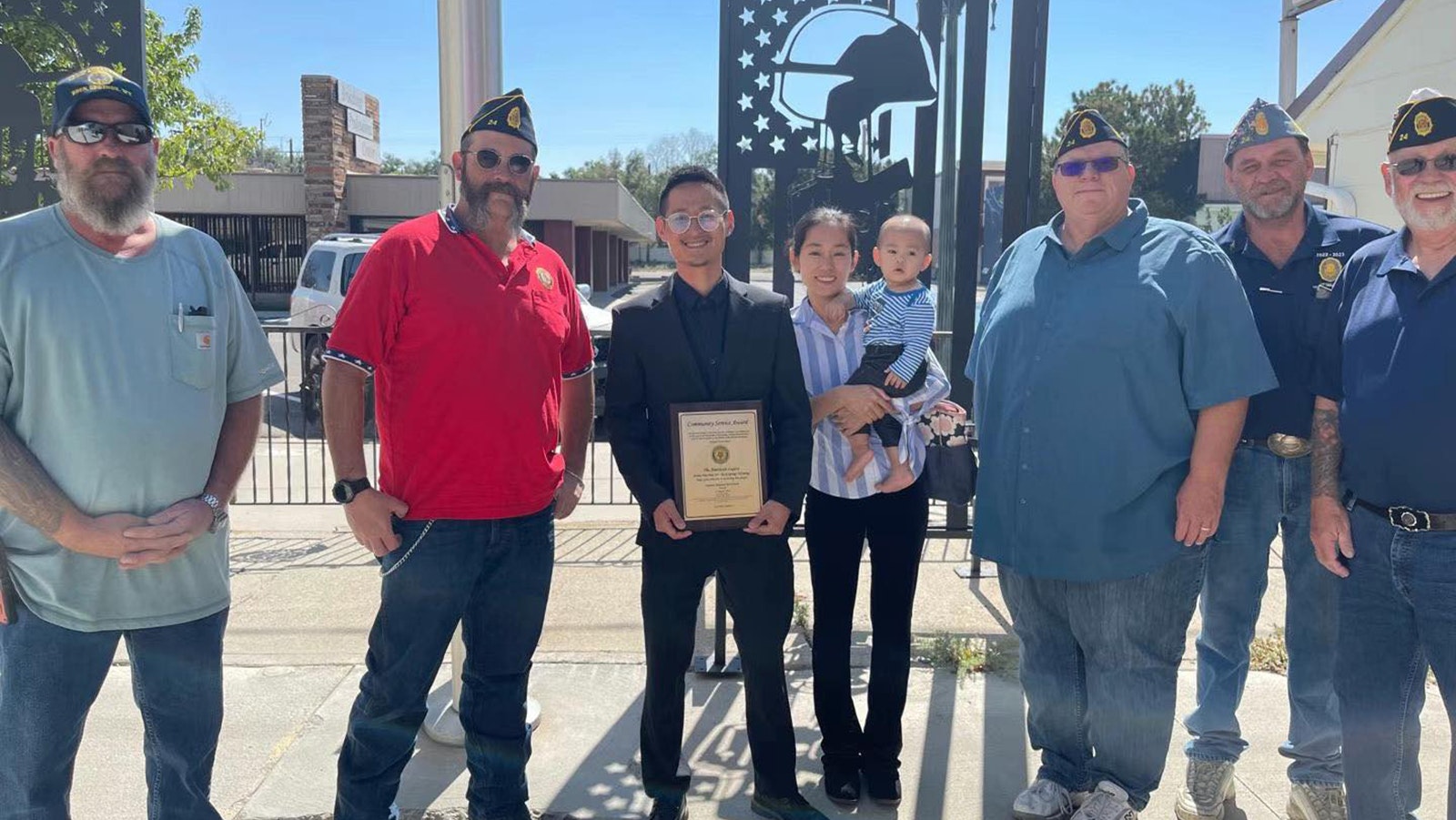 Jerry Zhang and his wife accept a Community Spirit Award in Rock Springs.