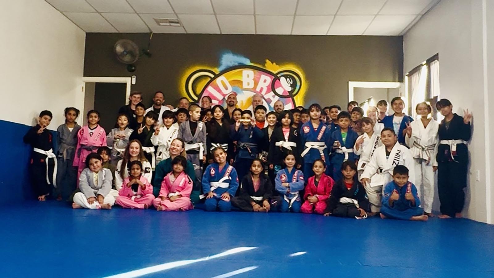 A group shot of some of the Sheridan Grindhouse gym team with a Rio Bravo class in a church compound in Anapra, Mexico.