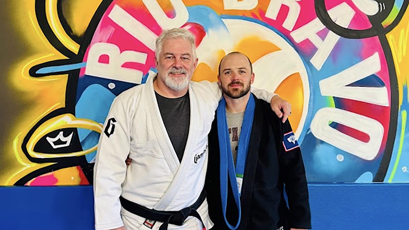 Matt Child from Sheridan poses with Steve Jolly, a minister in El Paso who started the Rio Bravo jiujitsu program.