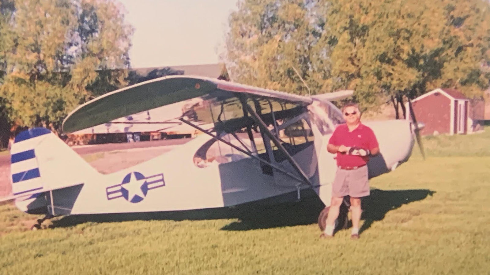 Joe Kenney posing with his 1946 Aeronica Champ. He was the voice of KOVE and KDLY for decades before retiring. Now, he hosts a podcast, Landeritis.