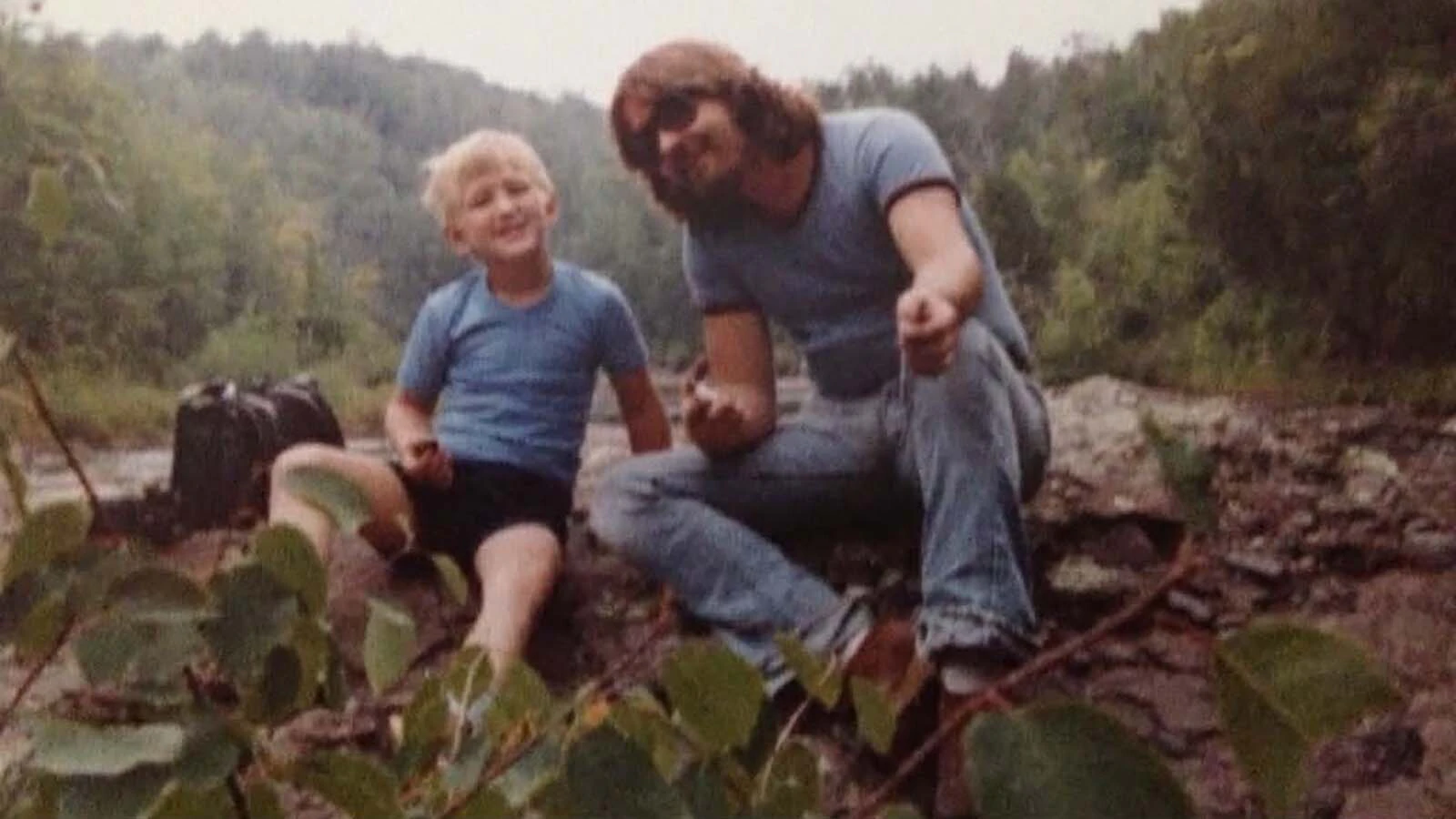 John Boutin is photographed with a friend's son during a camping trip close to the time he disappeared.