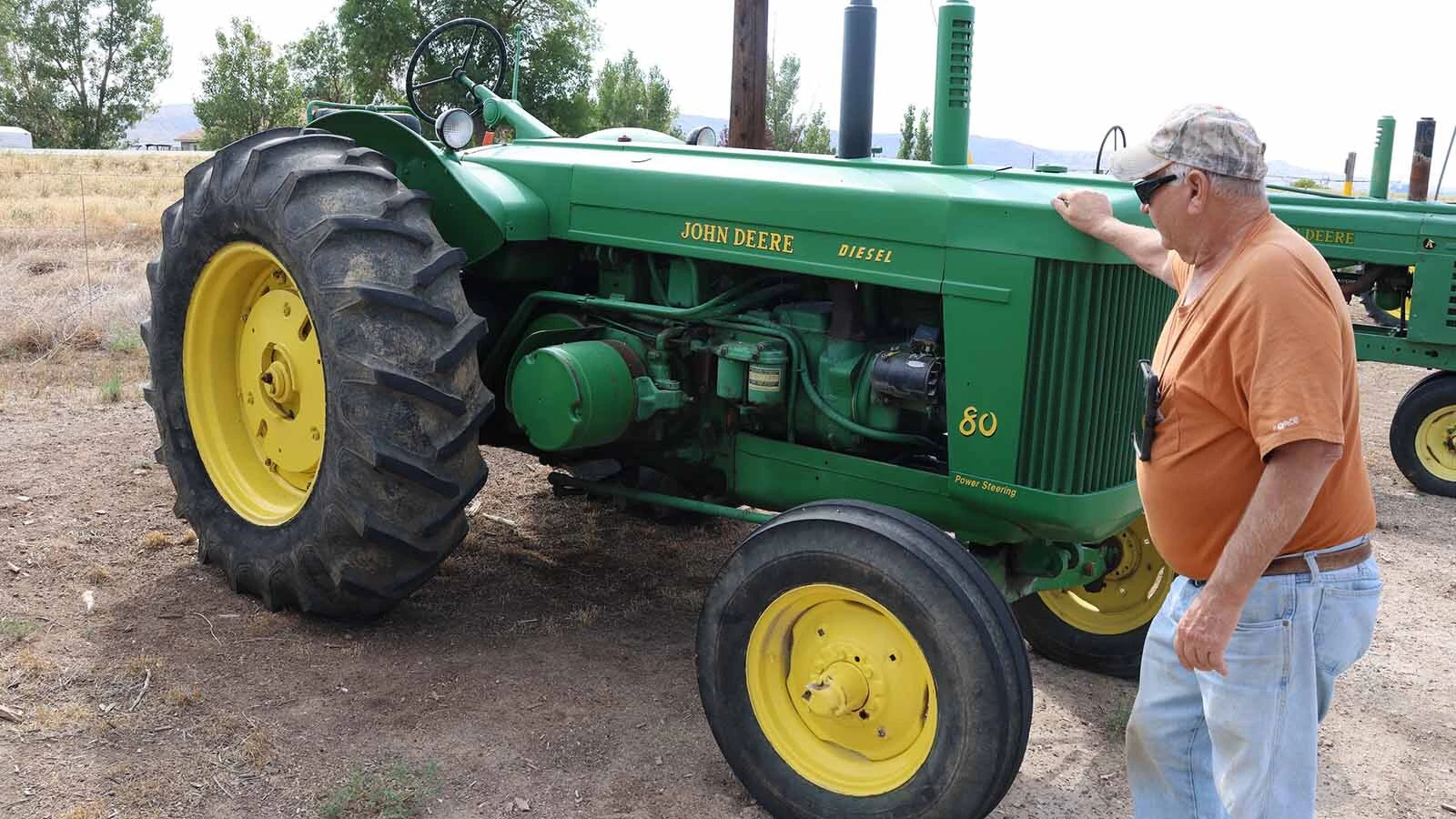 A big John Deere tractor outside Pete Smet’s recycling office helps promote the 250th birthday of the United States.