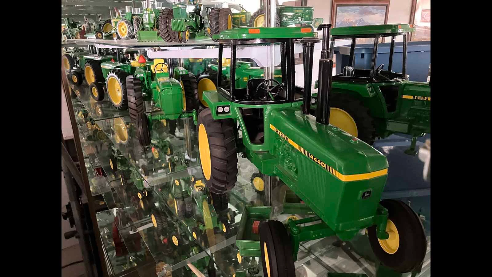 Pete Smet has dozens of toy tractors displayed on walls and cases in various buildings.