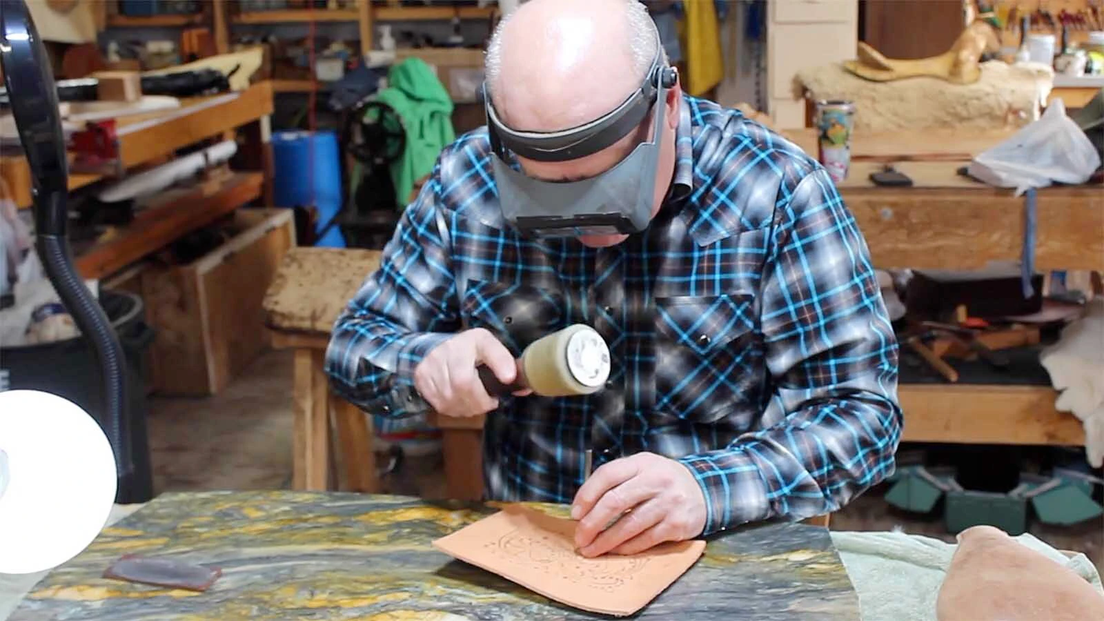 John L. Blair of Shell, Wyoming, is a master saddlemaker who commands more than $45,000 for a saddle, $15,000 for a leather bowl or $8,500 for a custom purse. He works listening to Mozart, one virtuoso inspiring another to create stunning leather art.