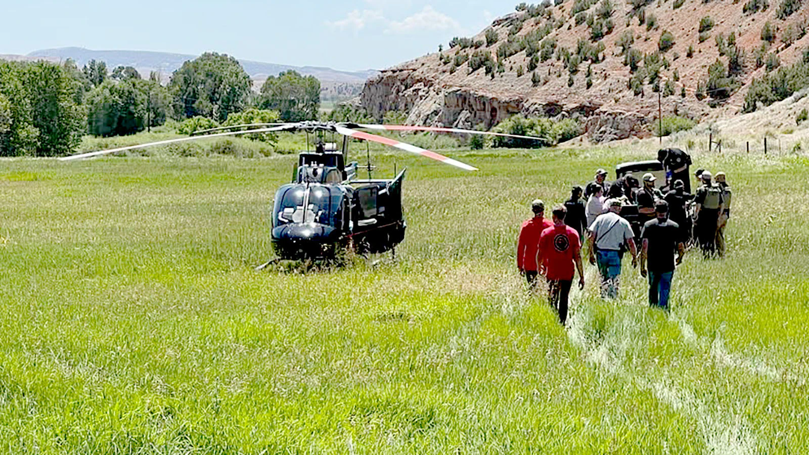Emergency responders gather near a First Flight of Wyoming helicopter after a horseback rider was injured in the remote Paintrock country near Hyattville in July.