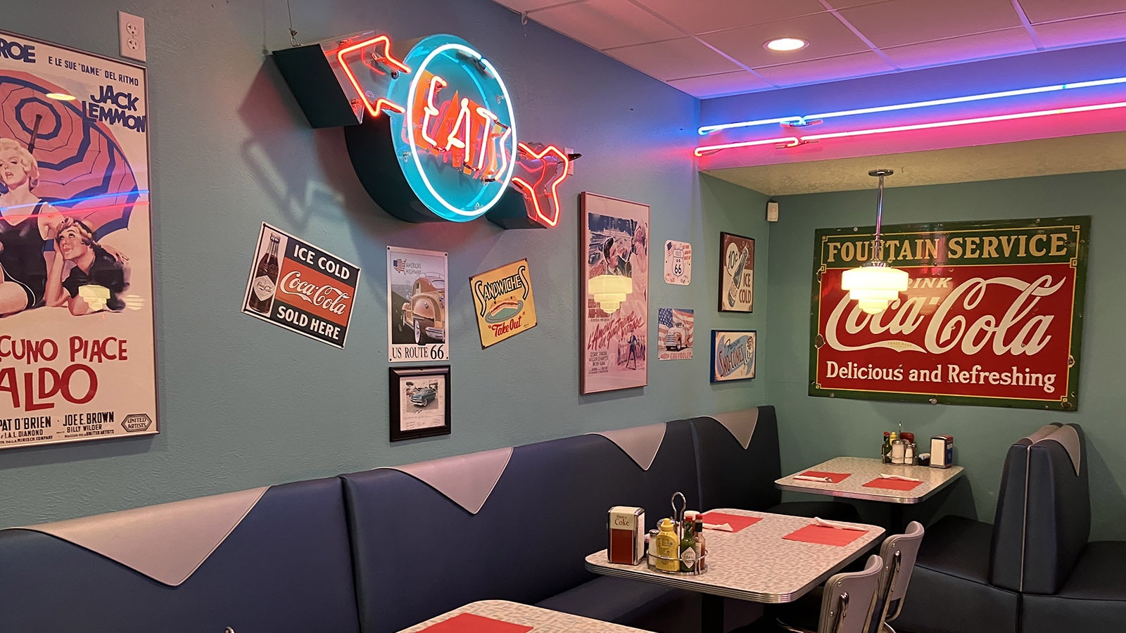 Checkered floors, tables and booths all reflect the diner atmosphere of the 1950s.