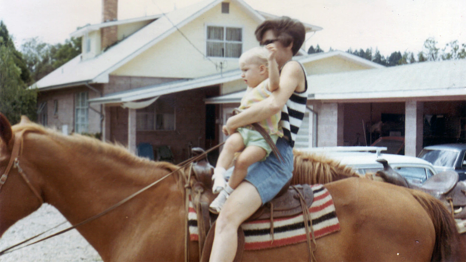 Wanda Swinney rides a horse outside of Jim Jones’ house in Redwood Valley, California, in 1969.