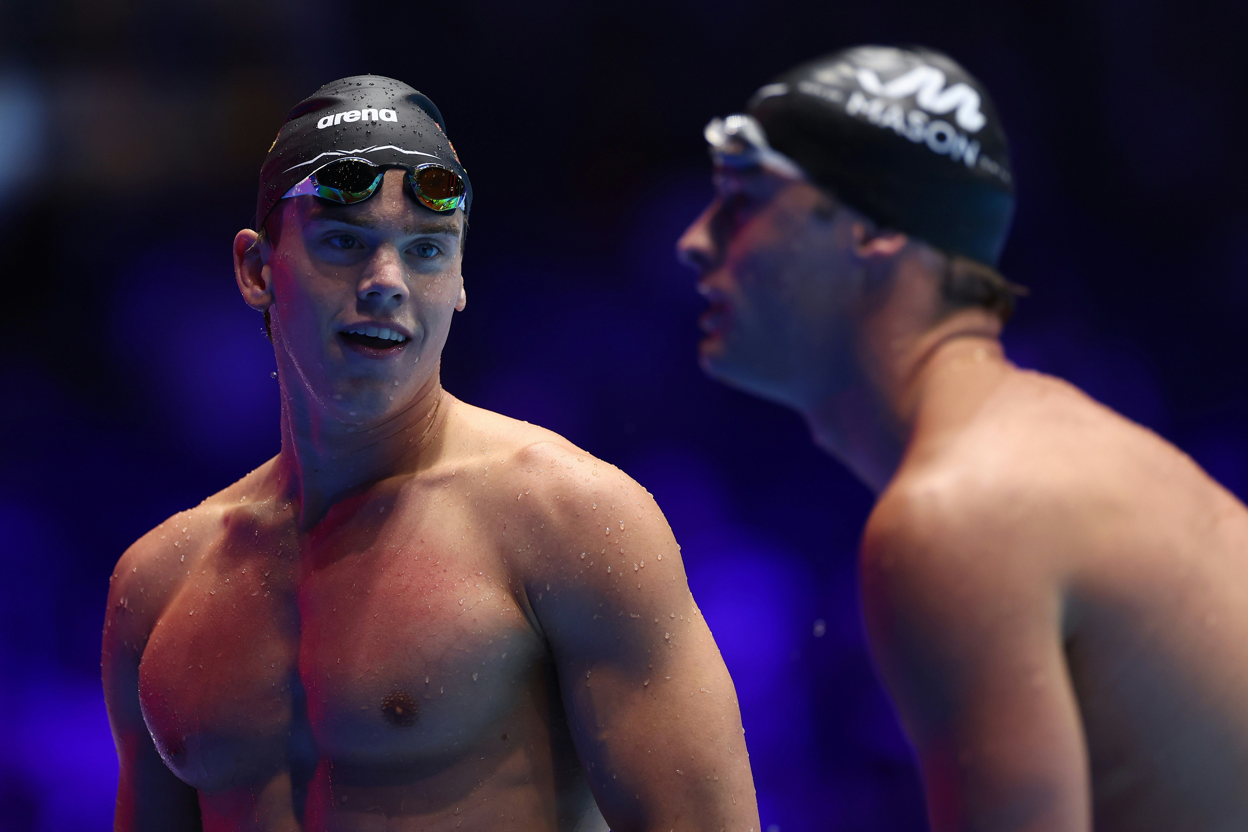 Jonny Kulow, left, and Adam Chaney of the United States react after a swim-off during the Men's 50-meter freestyle semifinal on Day Six of the 2024 U.S. Olympic Team Swimming Trials at Lucas Oil Stadium on June 20, 2024, in Indianapolis, Indiana.