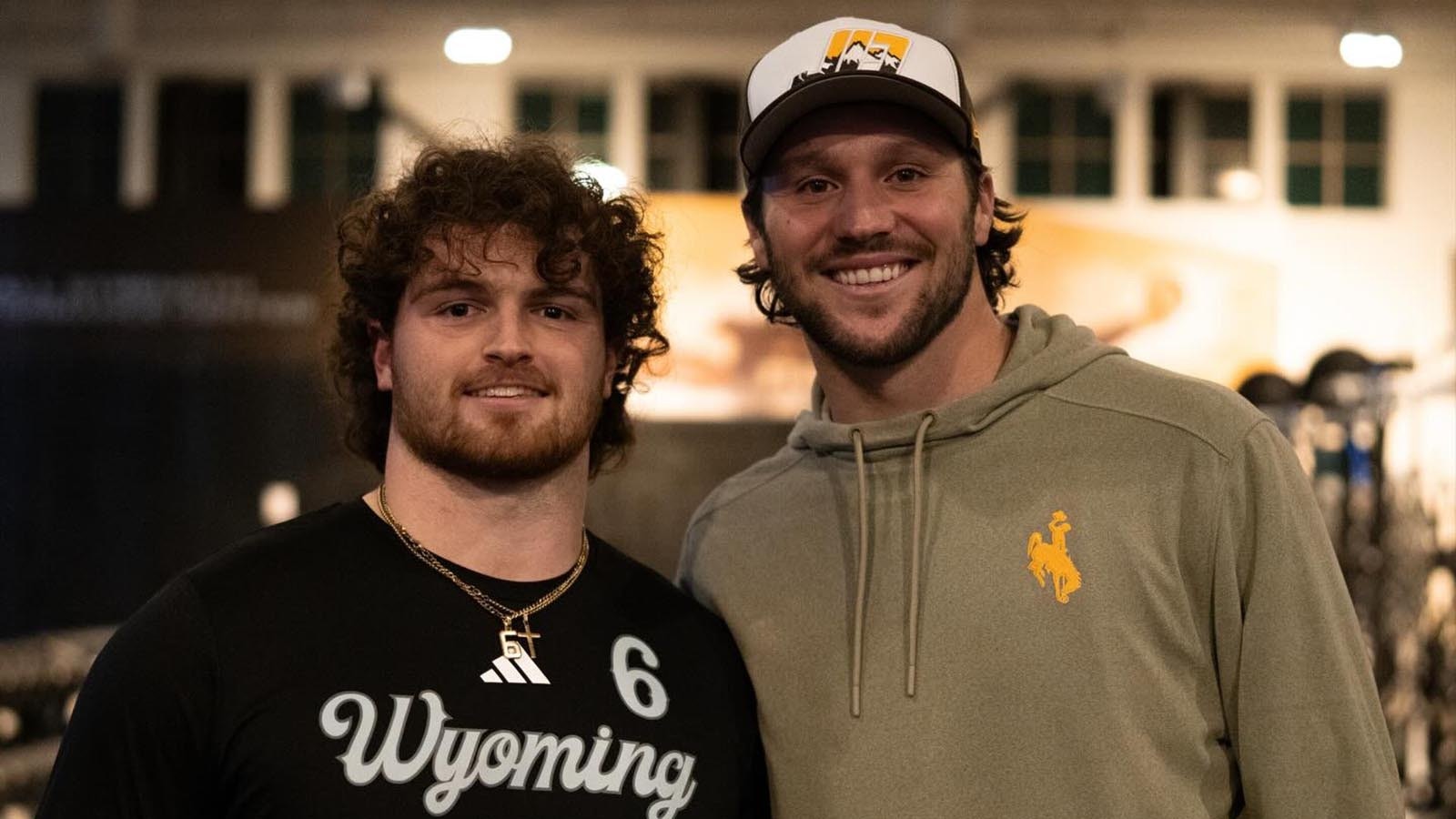 Former University of Wyoming quarterback, and reigning NFL MVP, Josh Allen visits with current UW football players Friday night after arriving in Laramie ahead of Saturday's halftime ceremony to retire his No. 17 jersey.