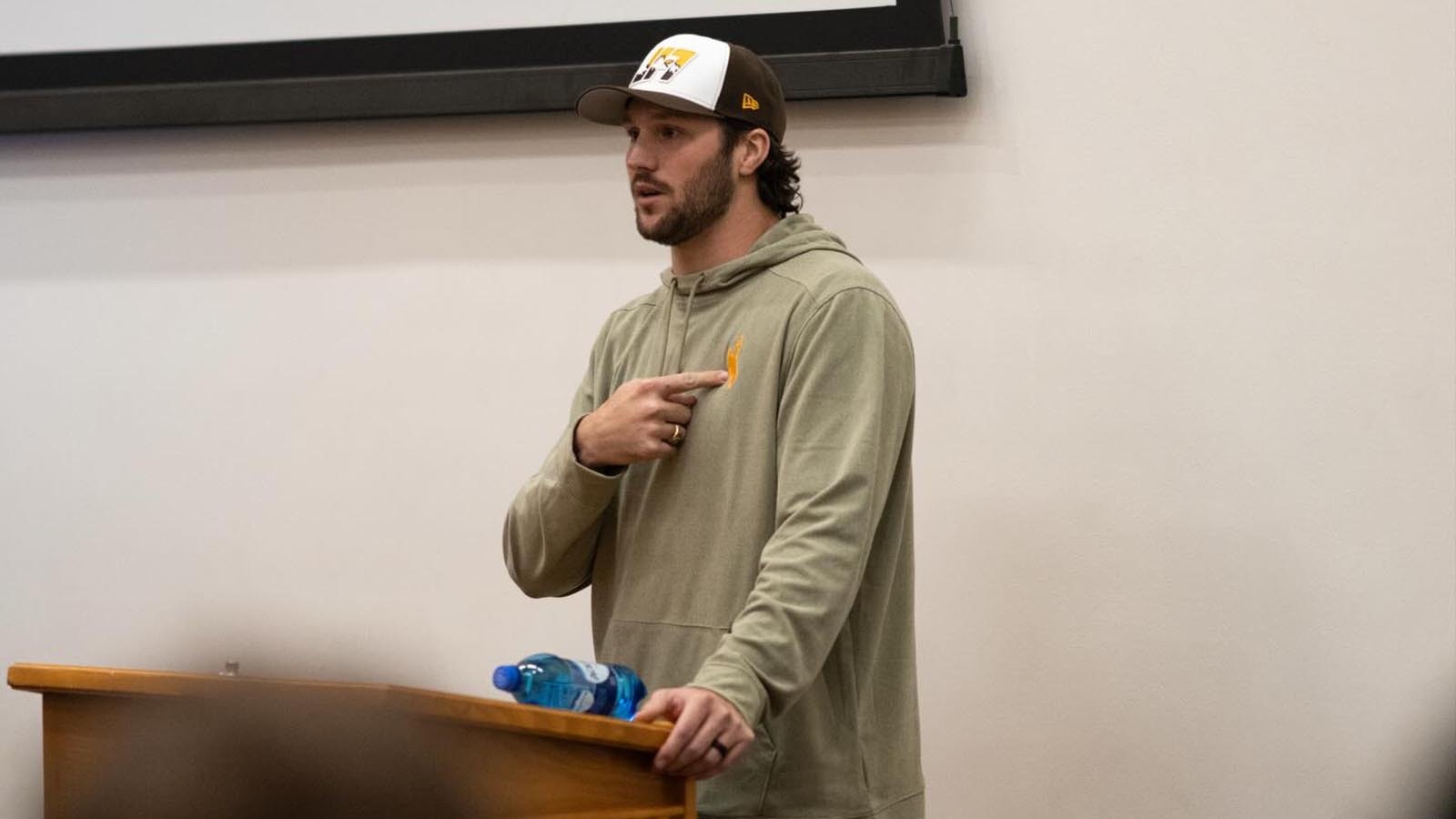 Former University of Wyoming quarterback, and reigning NFL MVP, Josh Allen visits with current UW football players Friday night after arriving in Laramie ahead of Saturday's halftime ceremony to retire his No. 17 jersey.