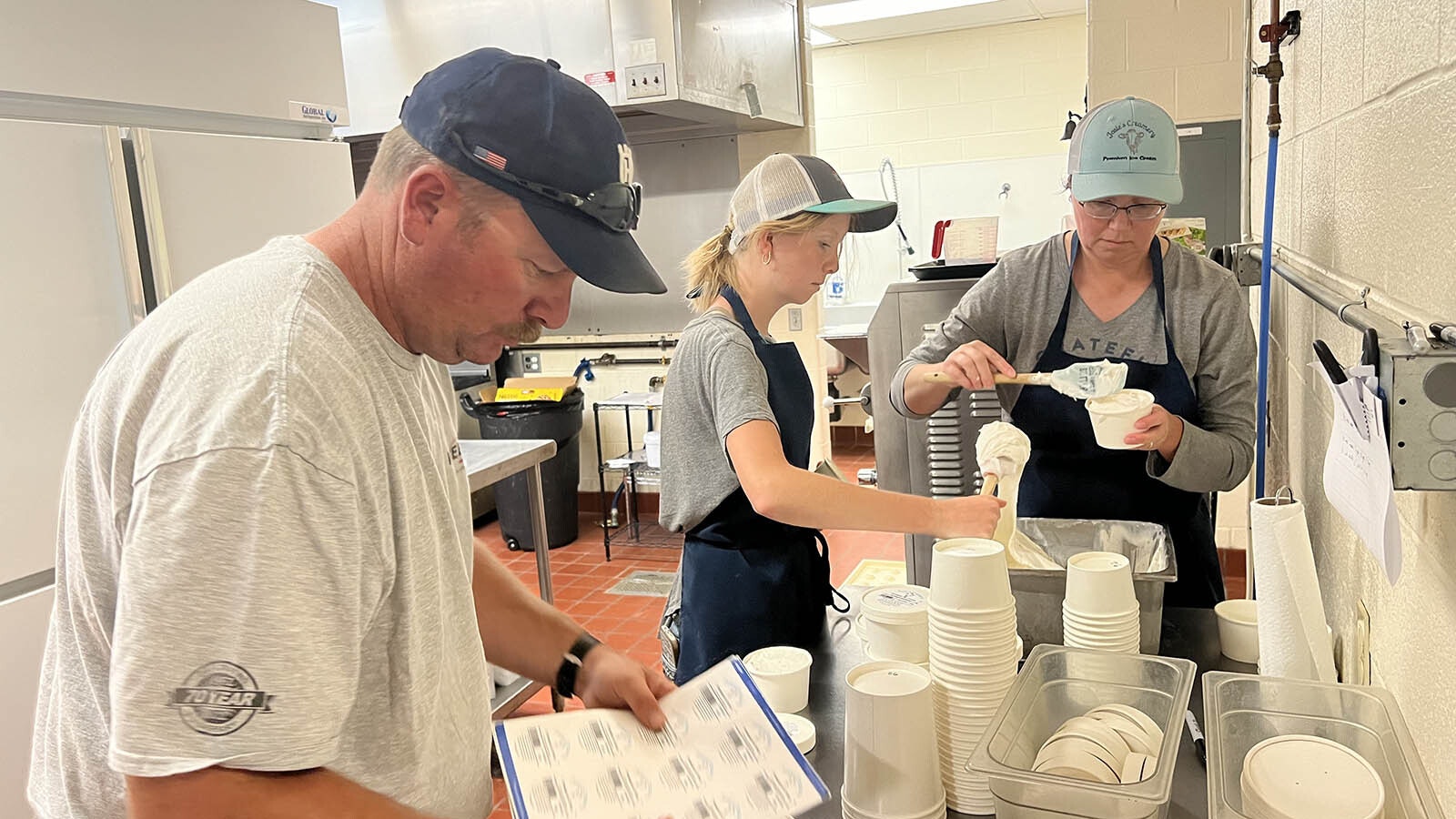 Cody, Grace and Coralee Smith package and label containers of ice cream in the Josie’s Creamery kitchen, inside the old school building in Burns.