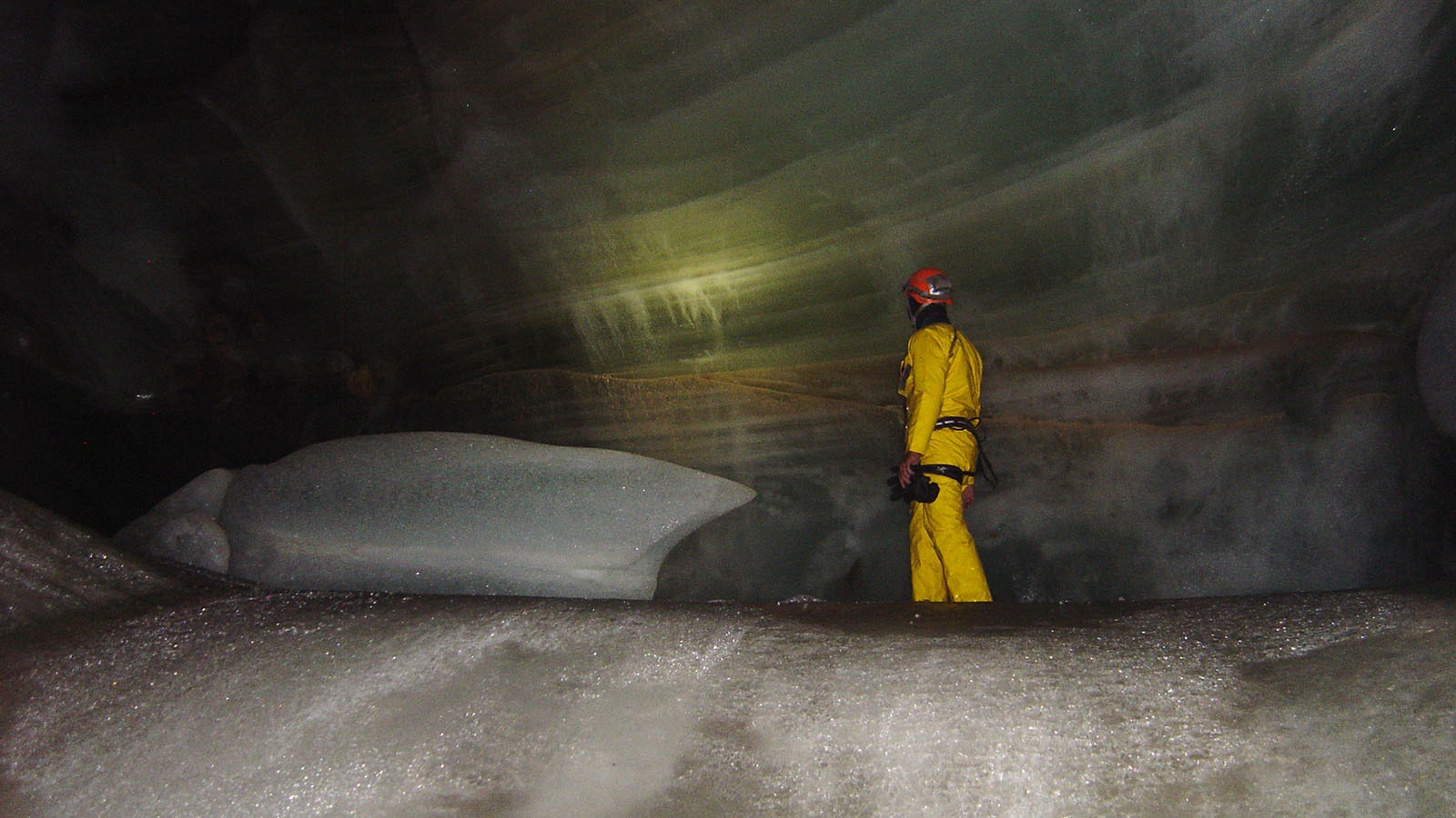 The base of an ice plug with prehistoric layers of ice that cavers rappel down to.