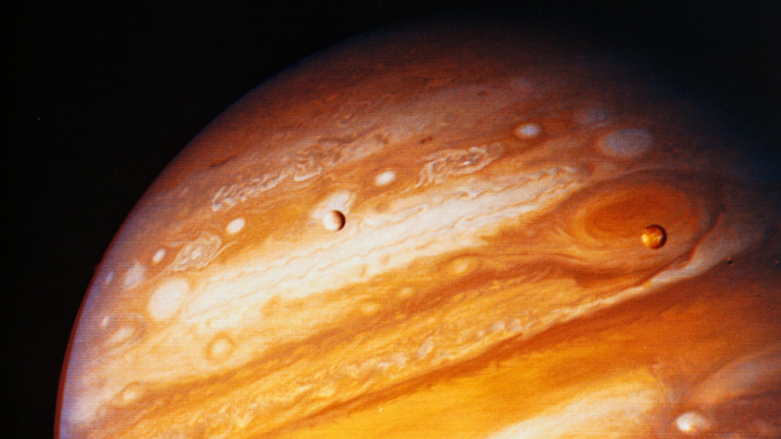 Jupiter and some of its moons as seen from Voyager 1.